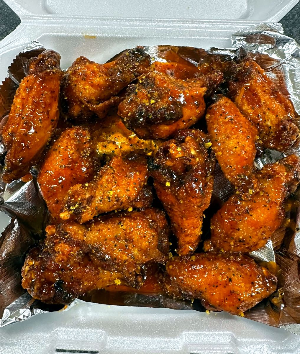 Saucy wings in a to-go box